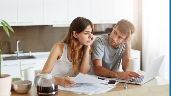 young-couple-checking-their-family-budget